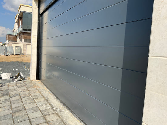 DARK Gray Overhead Door - باب كراج لون رصاصي غامق - BAB ALSARAY AUTOMATIC GATES & BARRIERS TRADING LLC