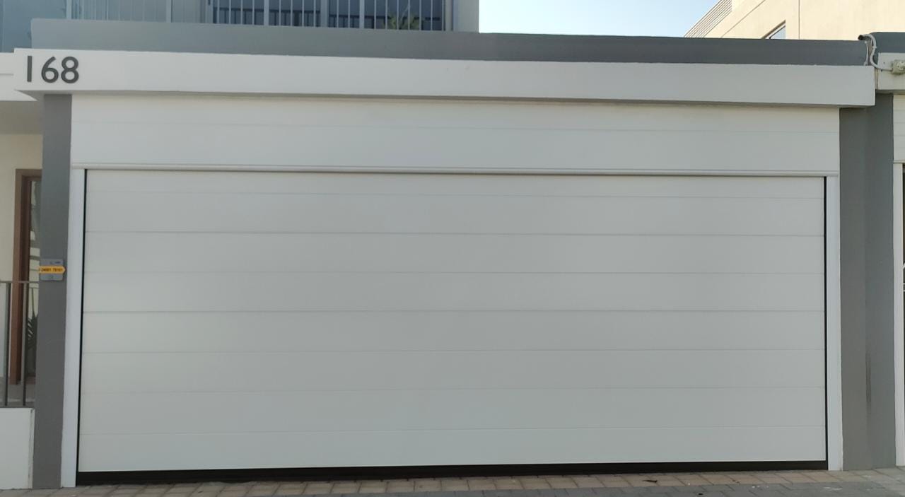 White Overhead Door  - باب كراج لون ابيض - BAB ALSARAY AUTOMATIC GATES & BARRIERS TRADING LLC